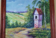 Zdjęcie przedstawia namalowany obraz ołtarzyku przy drodze polnej